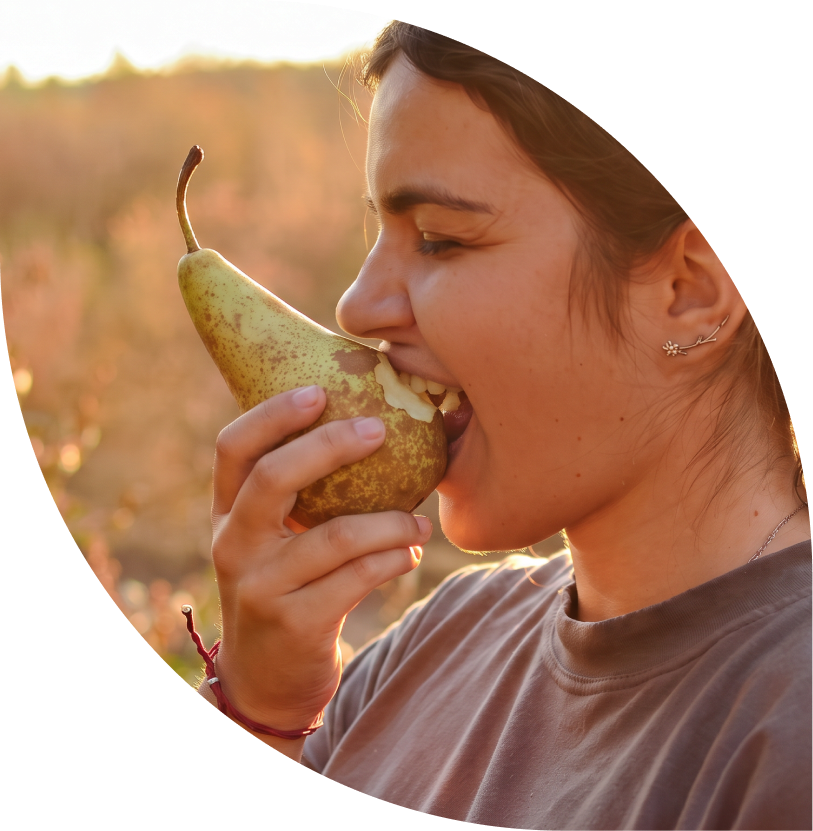 Woman tasting a Conference pear